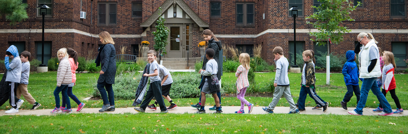 Greenwood Elementary School Students Walking Through Neighborhood