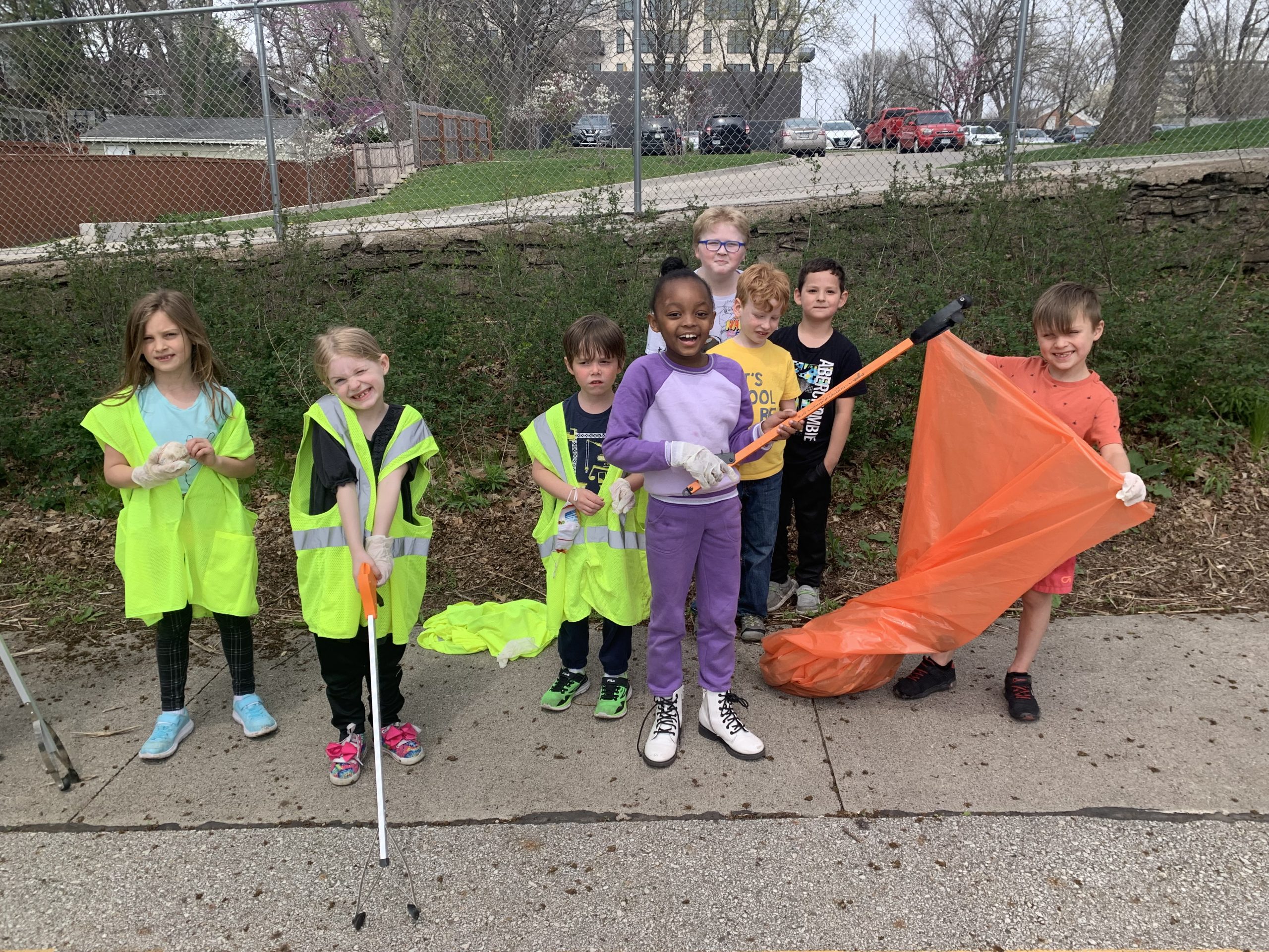 Students pose for a quick photo during the neighborhood cleanup walk