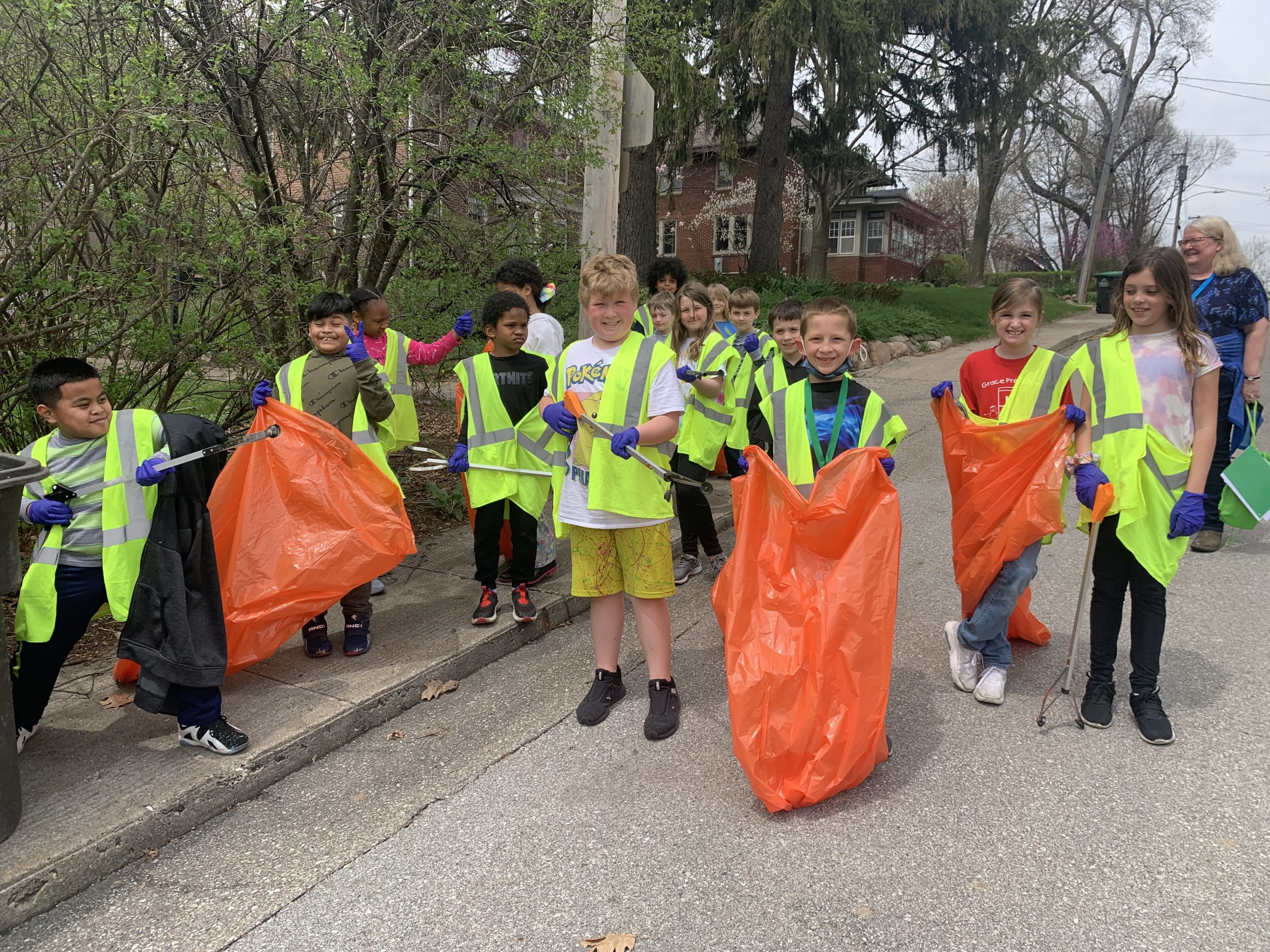 Students pose for a quick photo during the neighborhood cleanup walk.