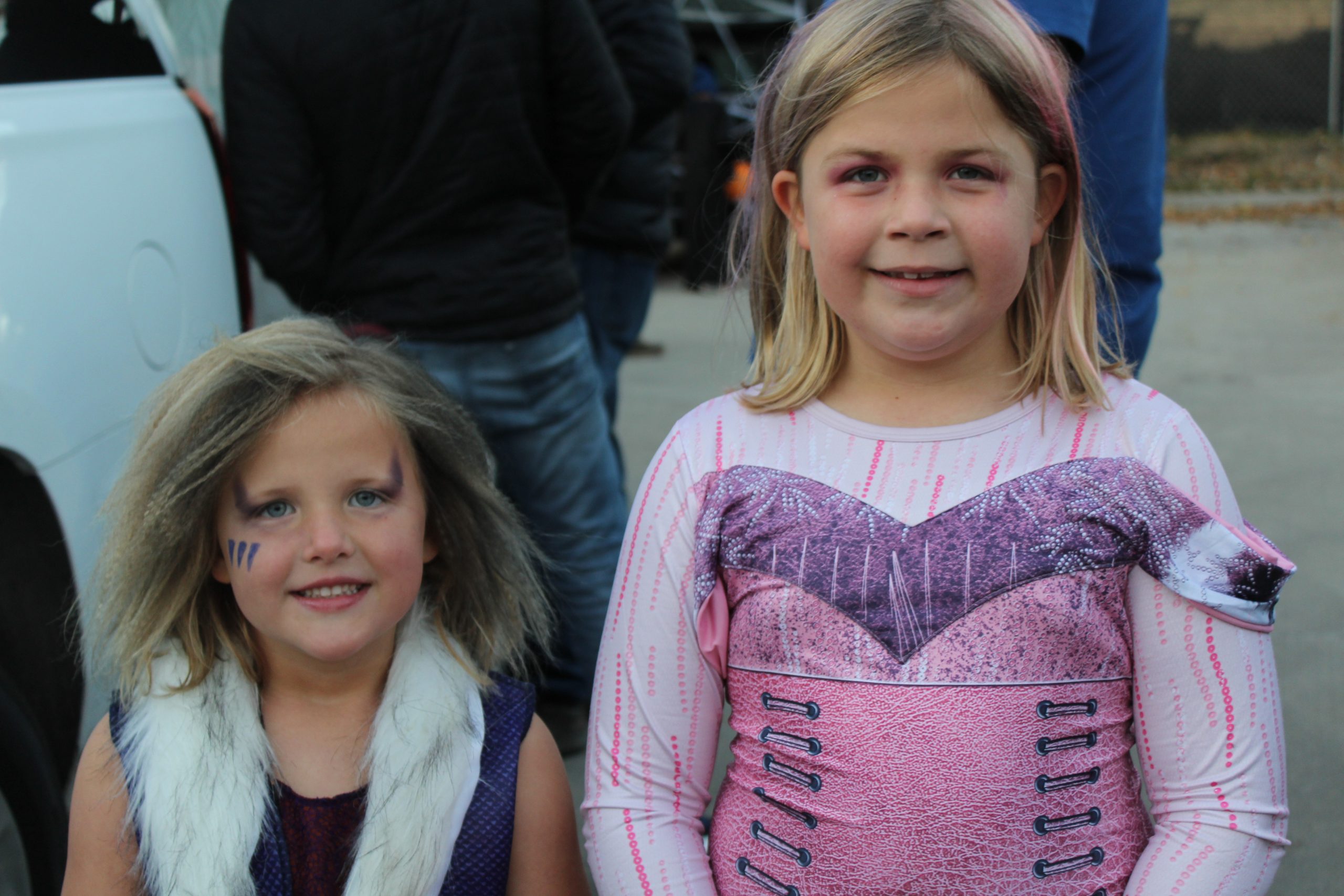Students take a break from Trunk or Treat to pose for a photo in their costumes.