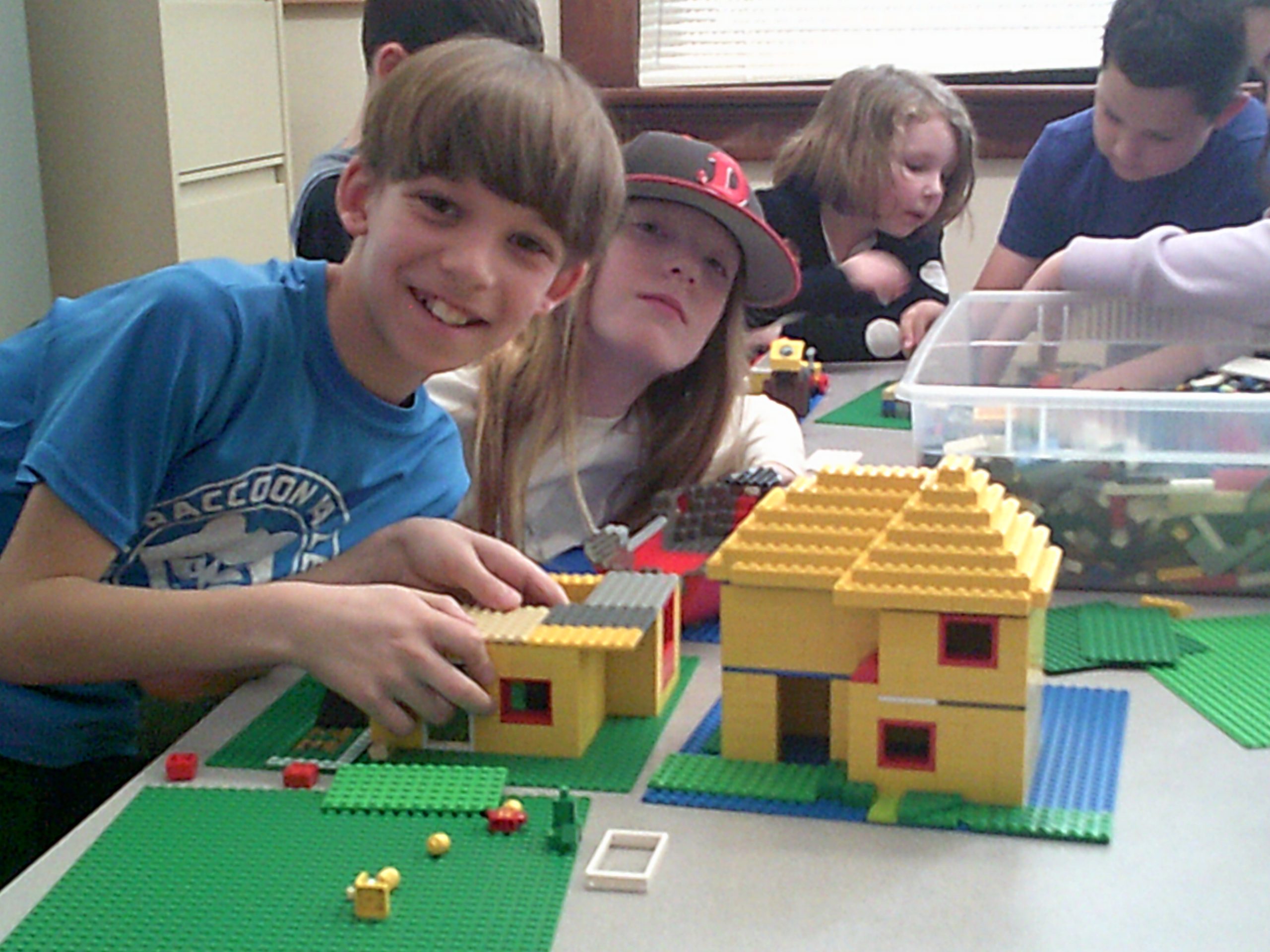 Students pose with their creations during Lego Club.